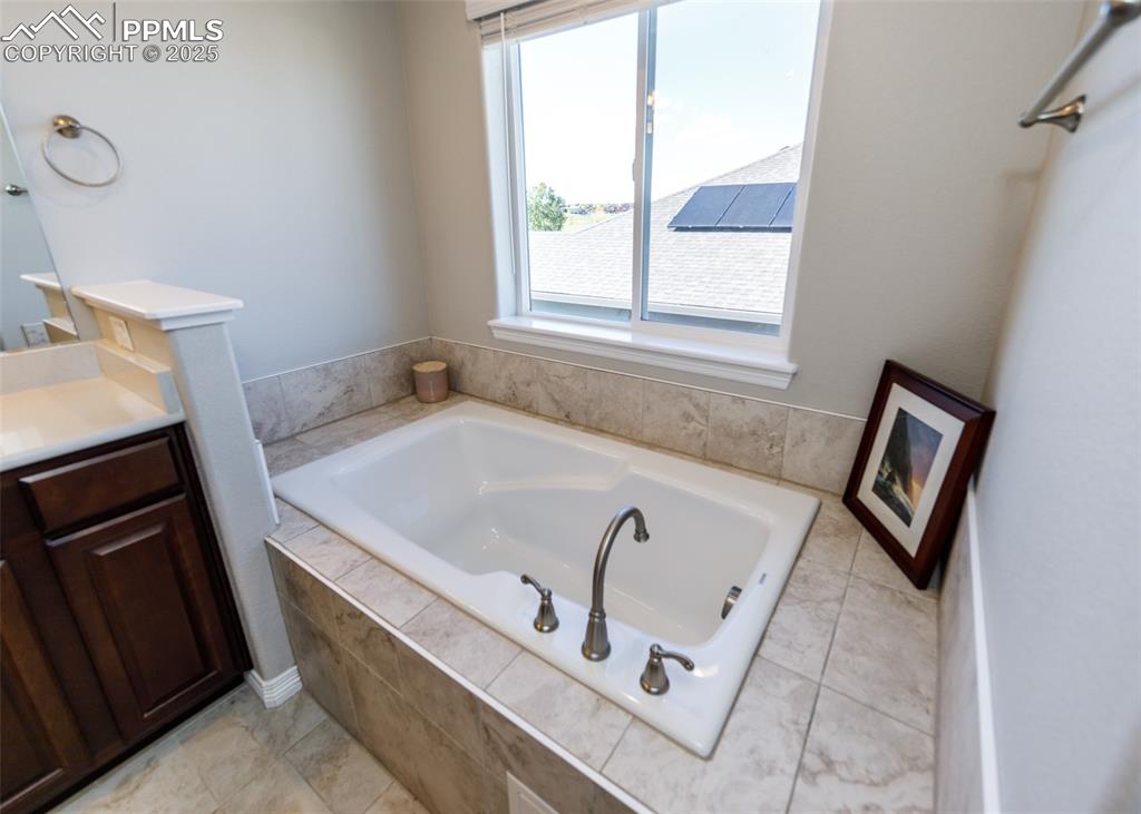 Image 21 of 43: Relax in the spa garden tub.