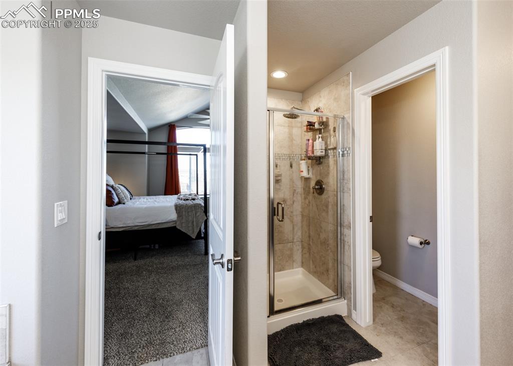 Image 23 of 43: Stand alone shower in the primary bathroom