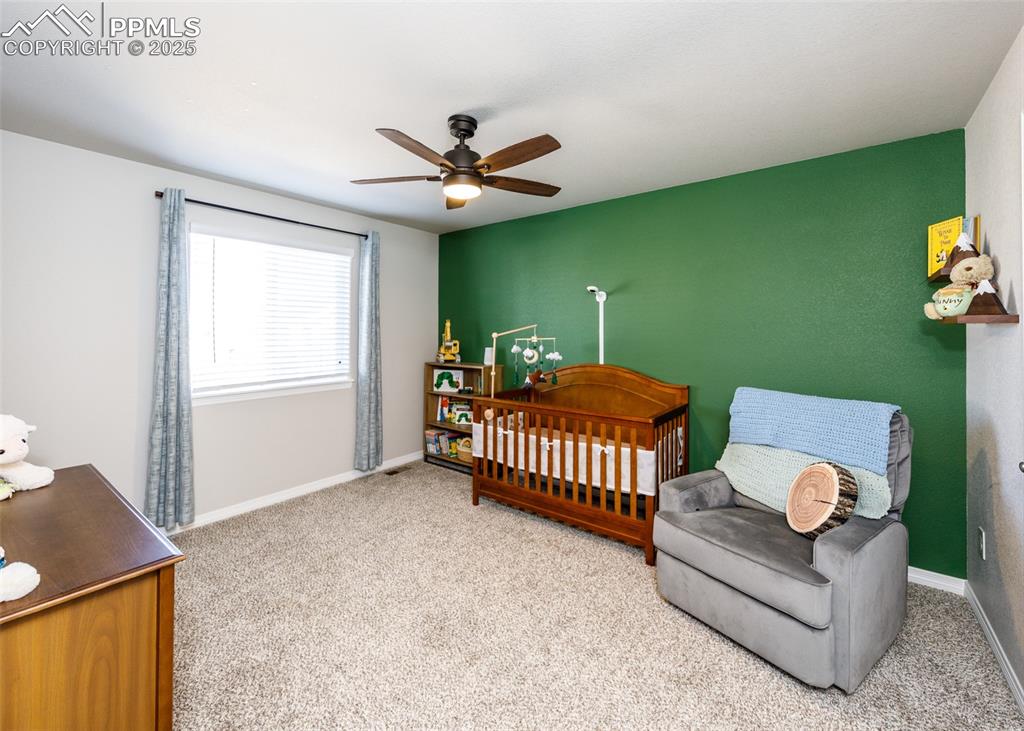 Image 29 of 43: Another secondary bedroom upstairs.