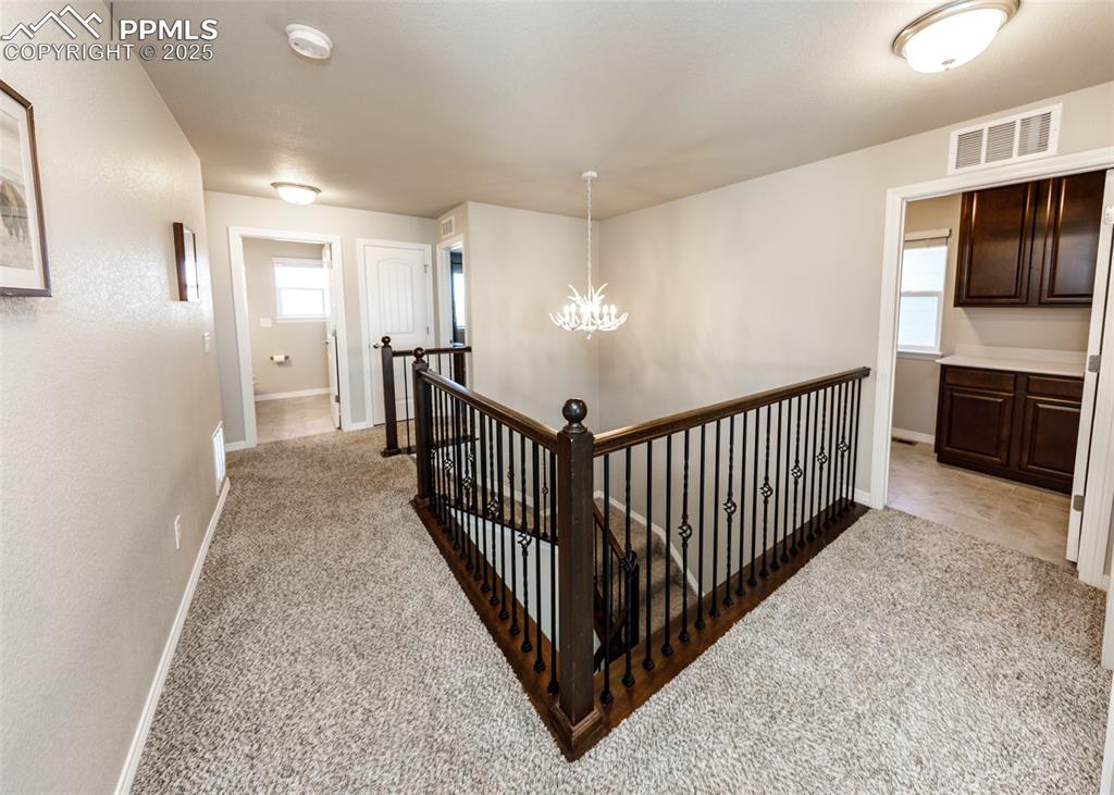 Image 32 of 43: View of upstairs hall with loft and laundry room