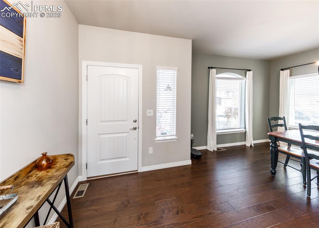 Image 5 of 43: Entry opens up to Dining area.