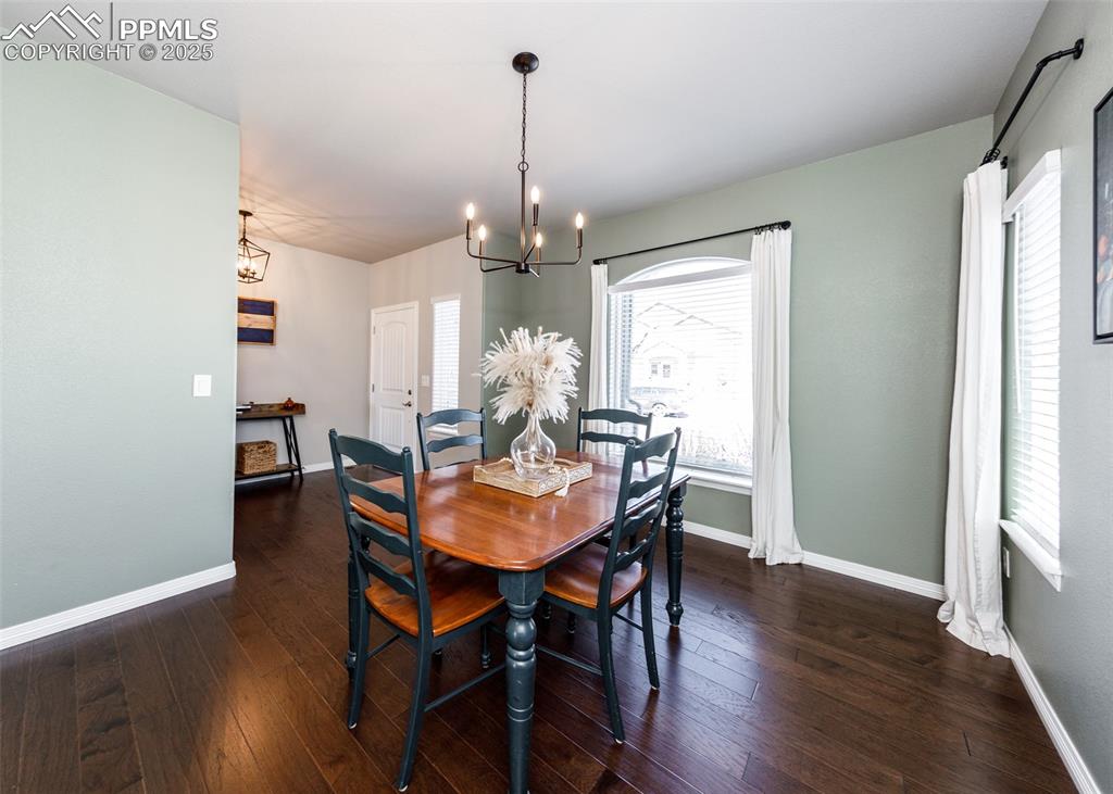 Image 6 of 43: Separate dining area with gleaming engineered Hardwood flooring.