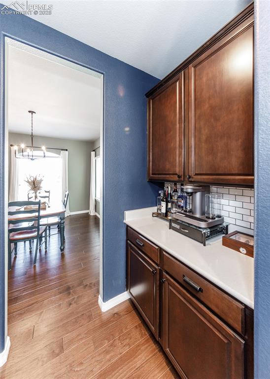 Image 7 of 43: Convenient Butlers panty connects the dining area and the kitchen.