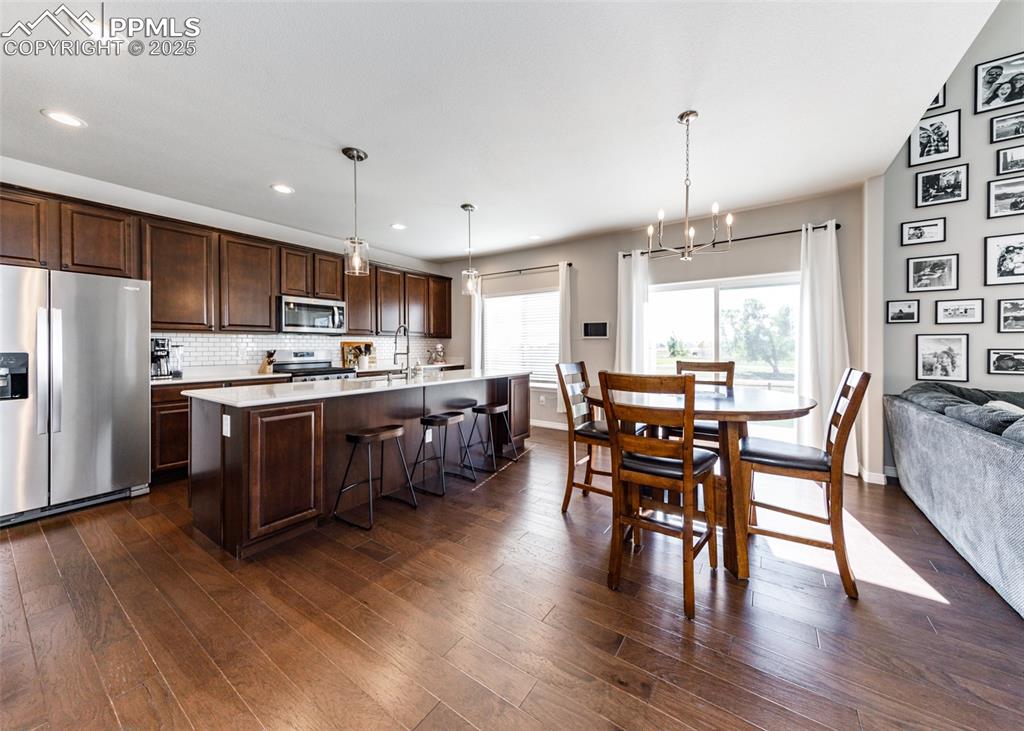 Image 8 of 43: Spacious Kitchen with breakfast area and walk-out.