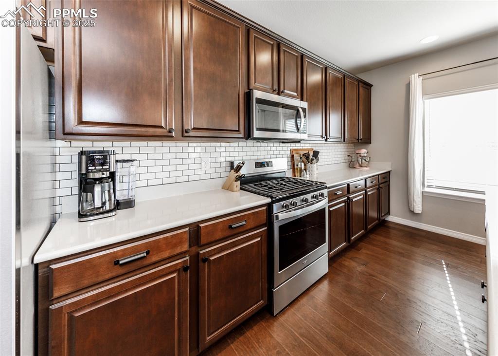 Image 9 of 43: Beautiful cabinetry and stainless steel appliance package.