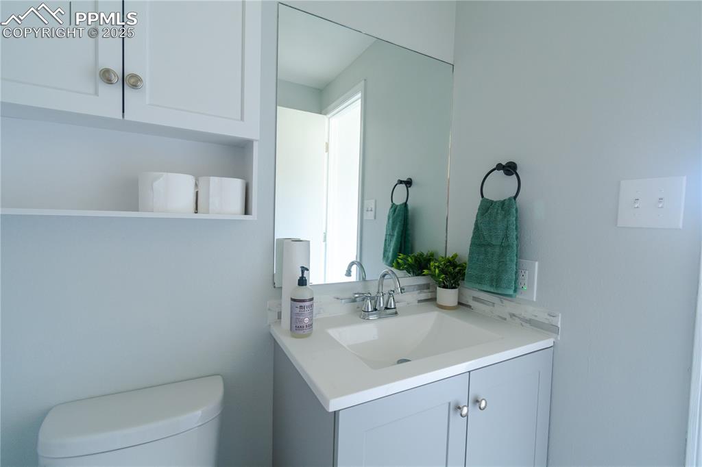 Image 16 of 37: Bathroom with vanity and toilet