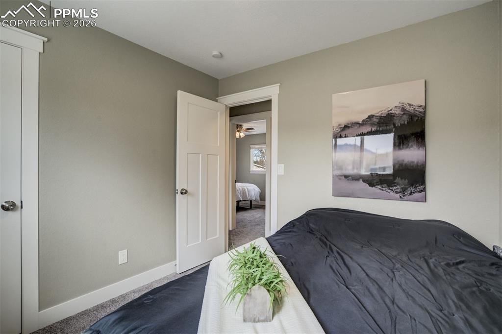 Image 19 of 29: Carpeted bedroom featuring baseboards