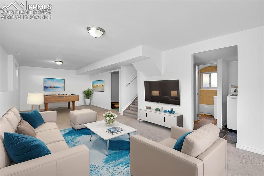 Image 20 of 30: Virtually staged - family room - basement level
