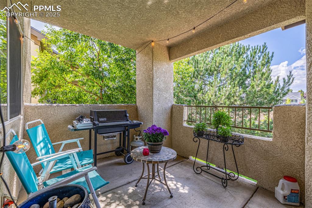 Image 17 of 24: Covered patio off of living room