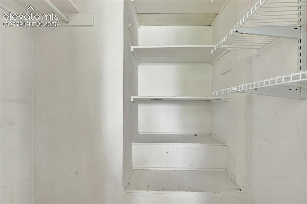 Image 10 of 39: Storage in living room closet