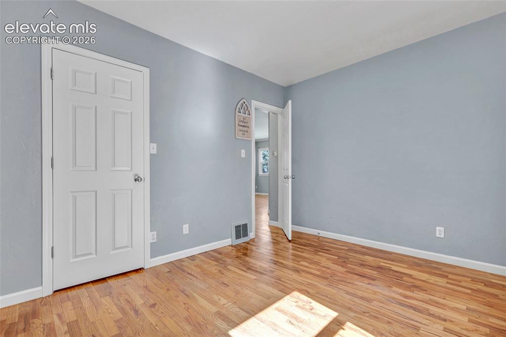 Image 20 of 39: Wood flooring, 6 panel doors