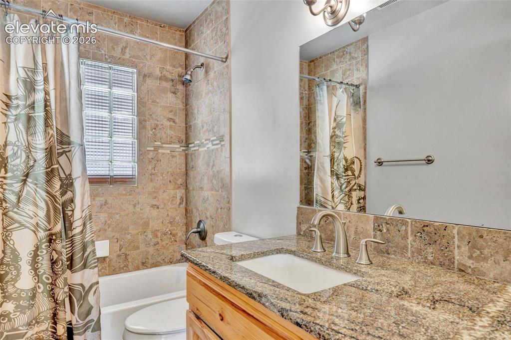 Image 21 of 39: Full bath - Granite countertops, 6 panel doors, tile flooring