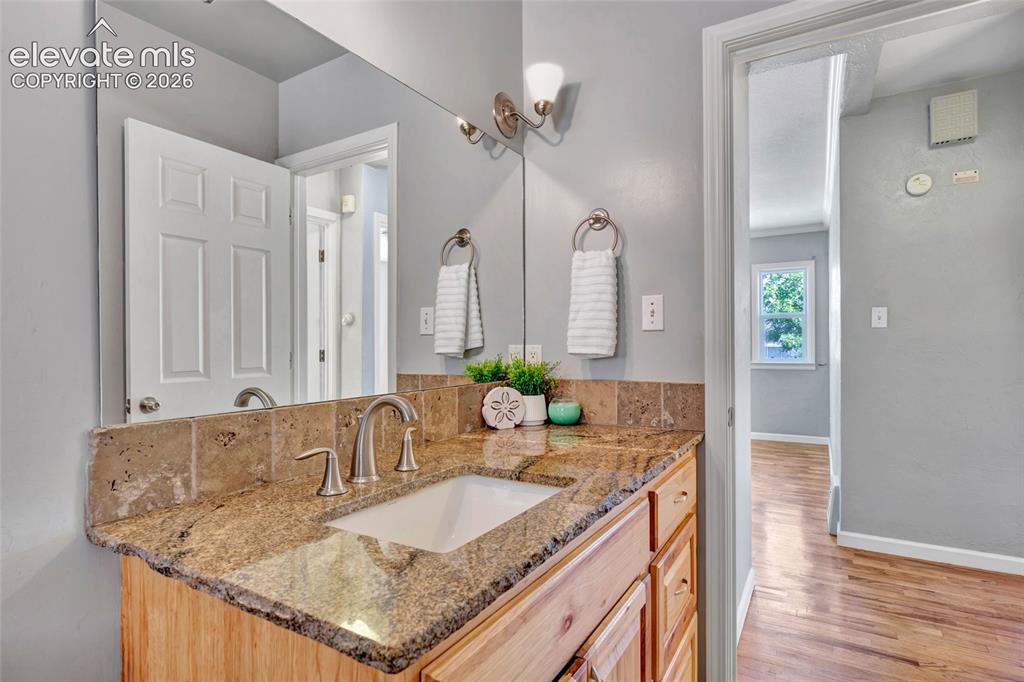 Image 22 of 39: Full bath - Granite countertops, 6 panel doors, tile flooring