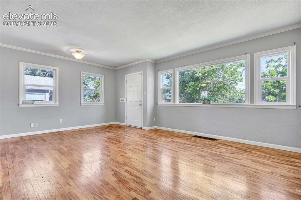 Image 3 of 39: Wood flooring, 6 panel doors, lots of natural light
