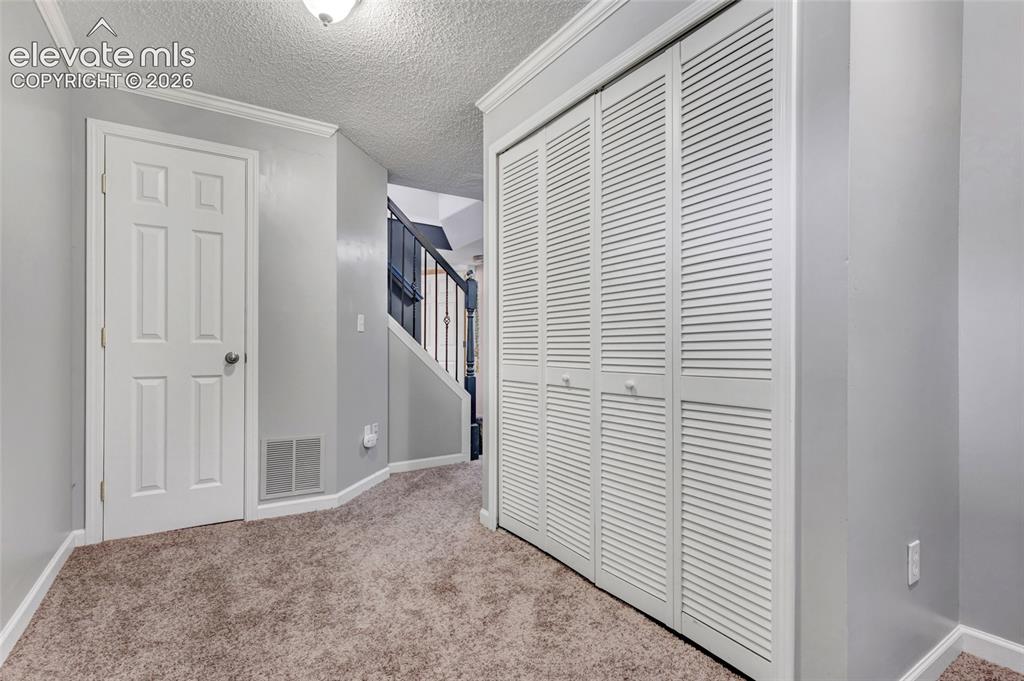Image 32 of 39: New carpet, built in shelving, great flex space with closet