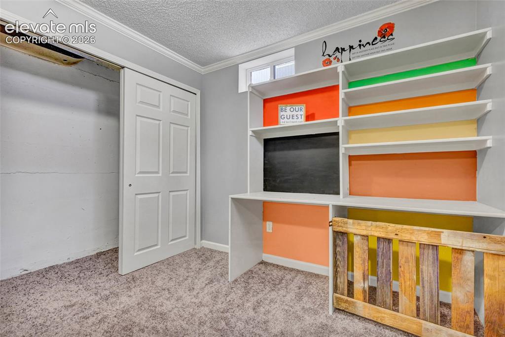 Image 4 of 39: New carpet, built in shelving, great flex space with closet