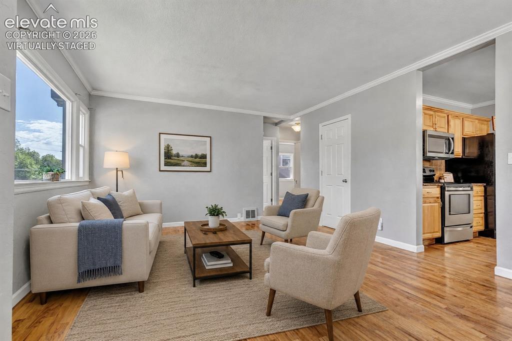 Image 7 of 39: Virtually Staged - Wood flooring, 6 panel doors, lots of natural light