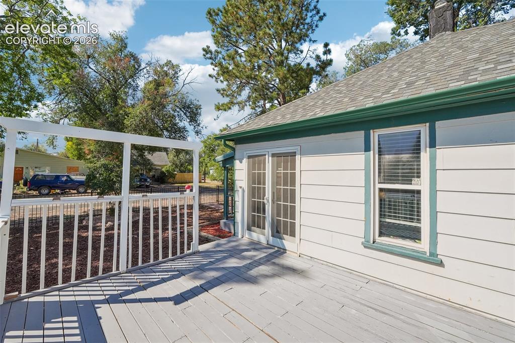 Image 13 of 43: Deck off sunroom 