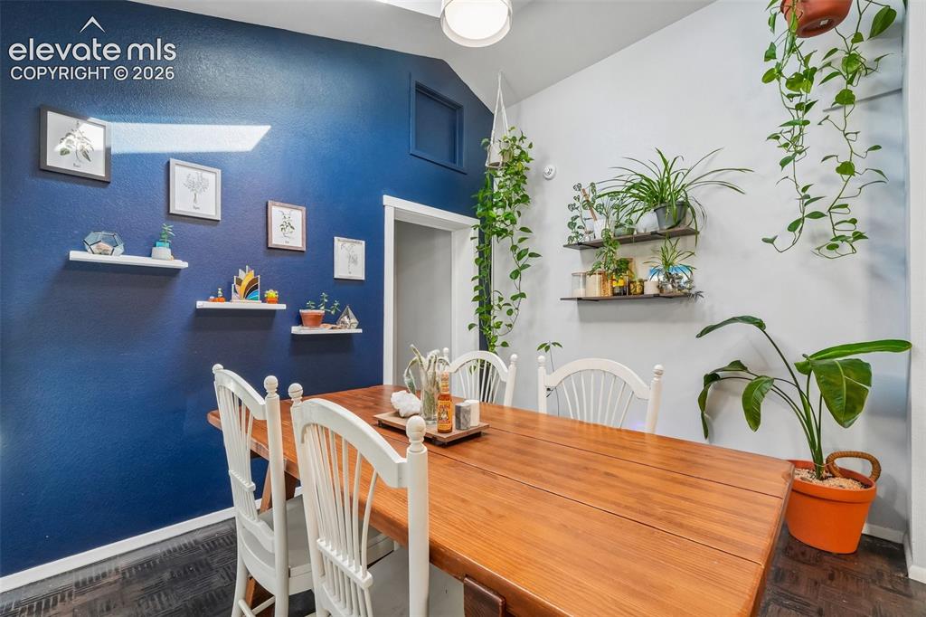Image 20 of 43: Dining area with skylights