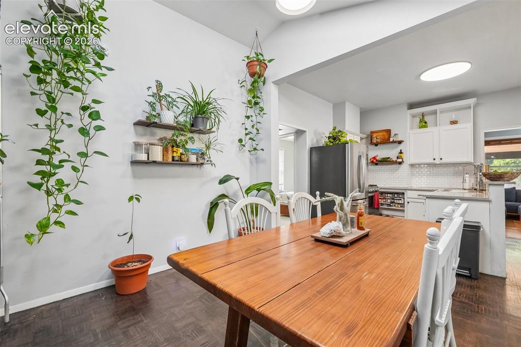 Image 21 of 43: Dining area with skylights
