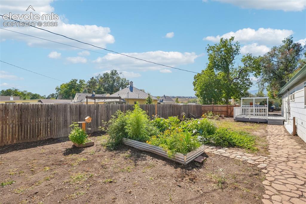 Image 35 of 43: Backyard with garden