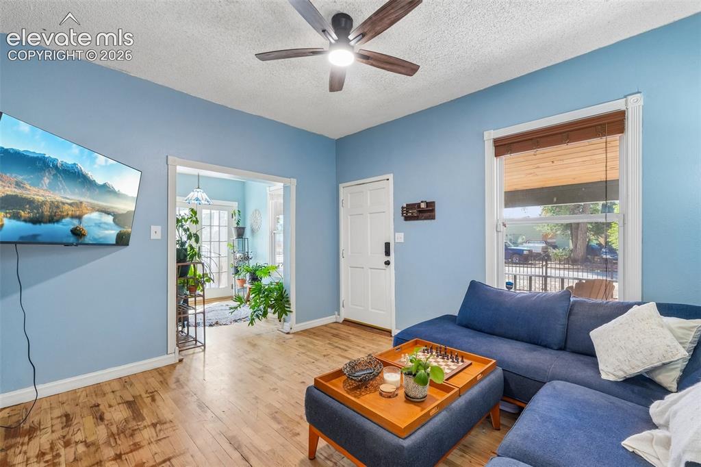 Image 9 of 43: Living room looking to sunroom with walk out