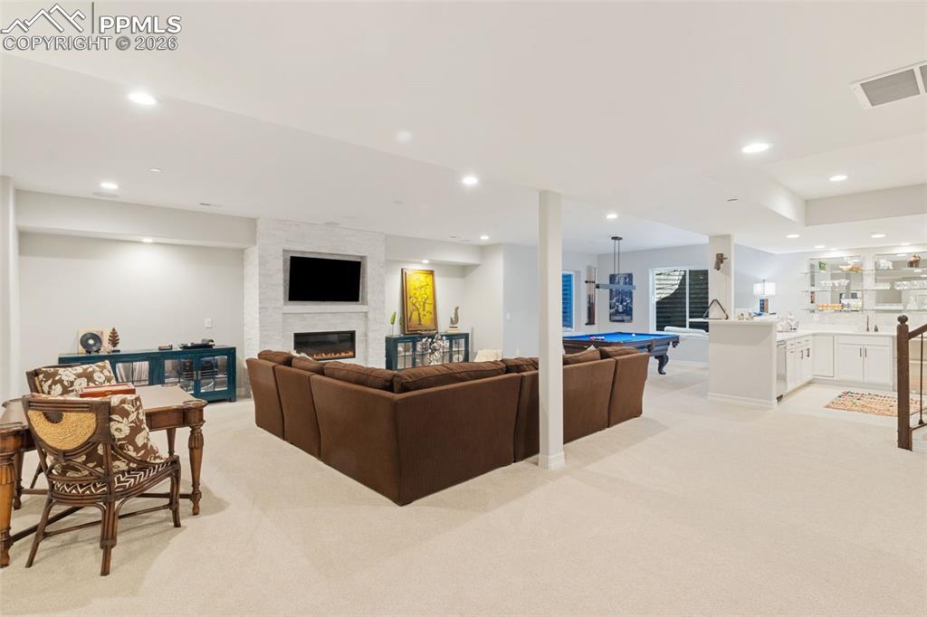 Image 26 of 49: This basement is a host’s dream, intelligently divided into distinct conver