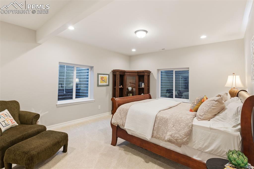 Image 31 of 49: Thoughtful placement of egress windows ensures safety while flooding the sp