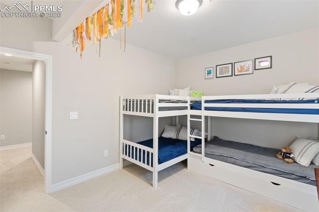 Image 36 of 49: The bedroom offers ample space for many different furniture configurations
