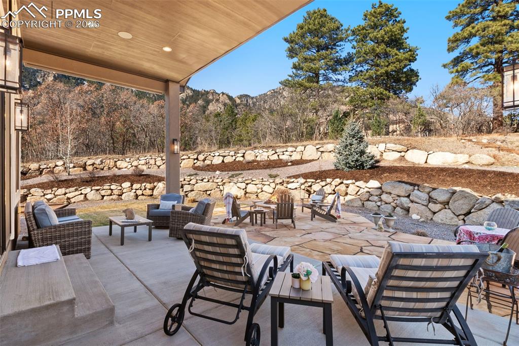 Image 38 of 49: Terraced landscaping perfectly frames the outdoor lounge areas, creating di