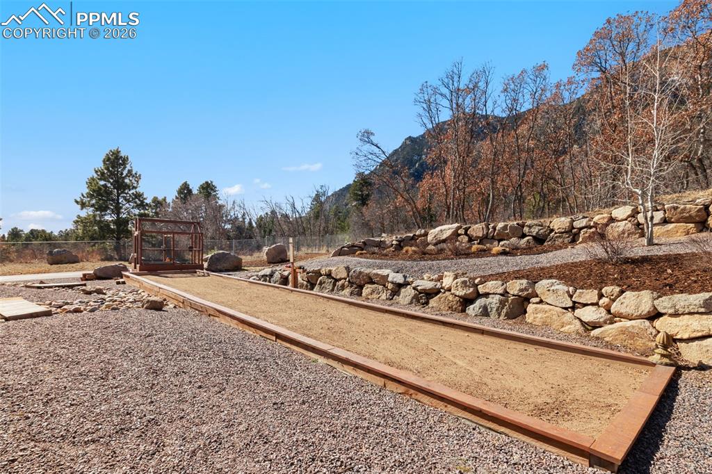 Image 40 of 49: A custom bocce ball court adds an unexpected layer of luxury recreation to 