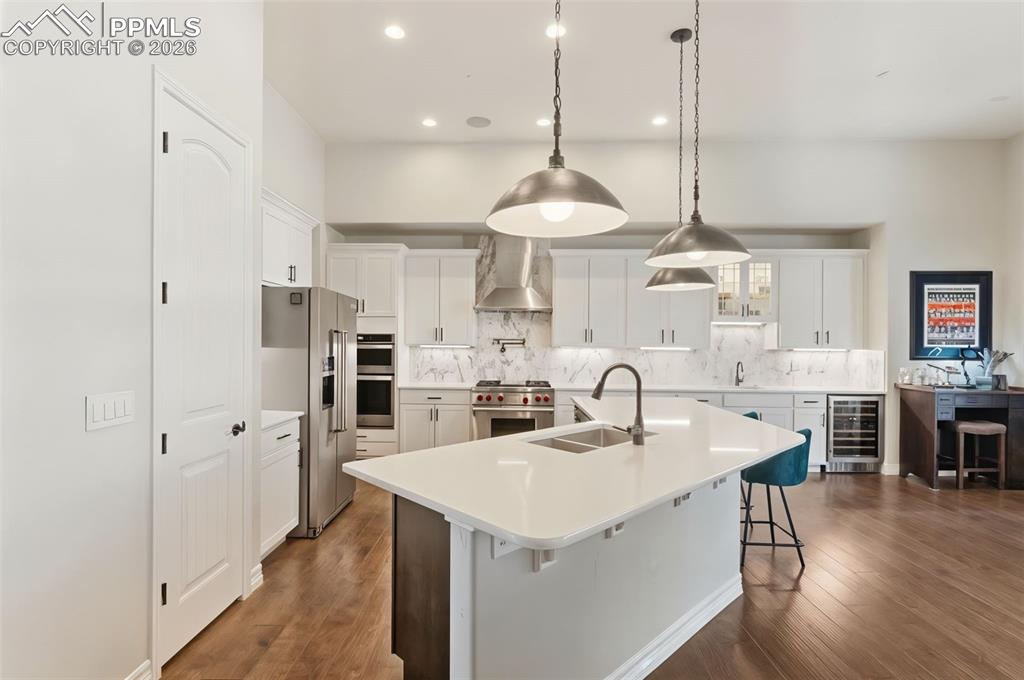 Image 9 of 49: A true culinary workspace, this layout boasts extensive counter space, unde