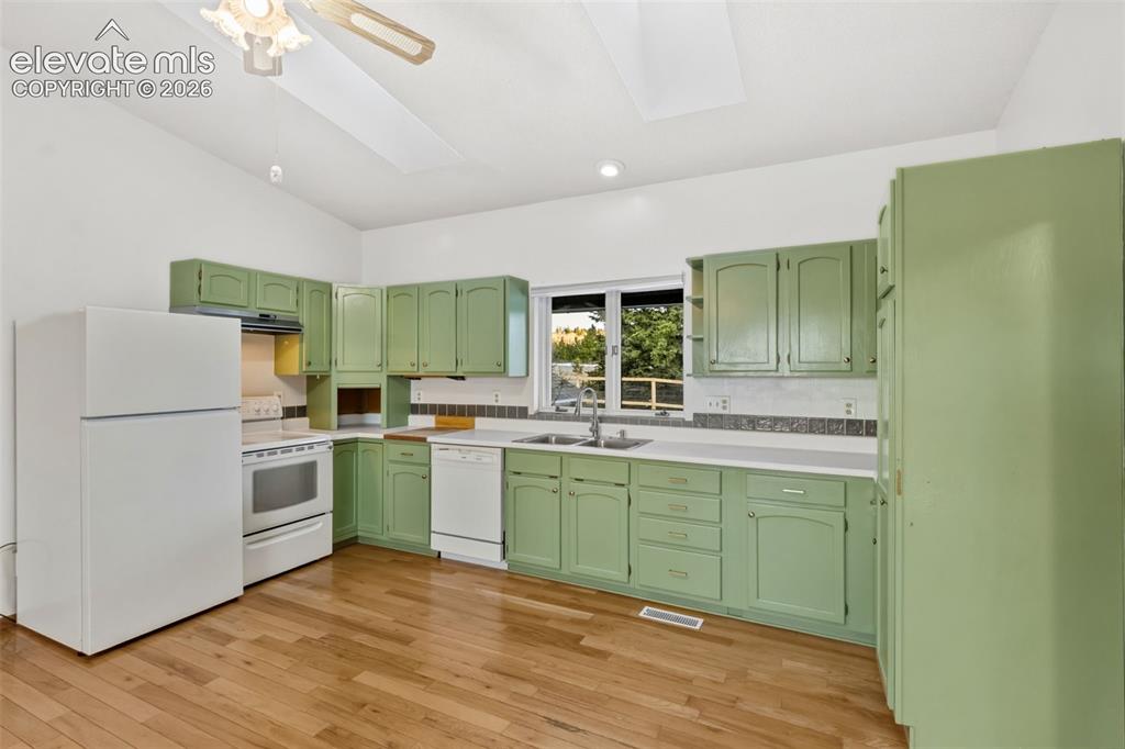 Image 12 of 38: Open Kitchen Concept for older construction is amazing