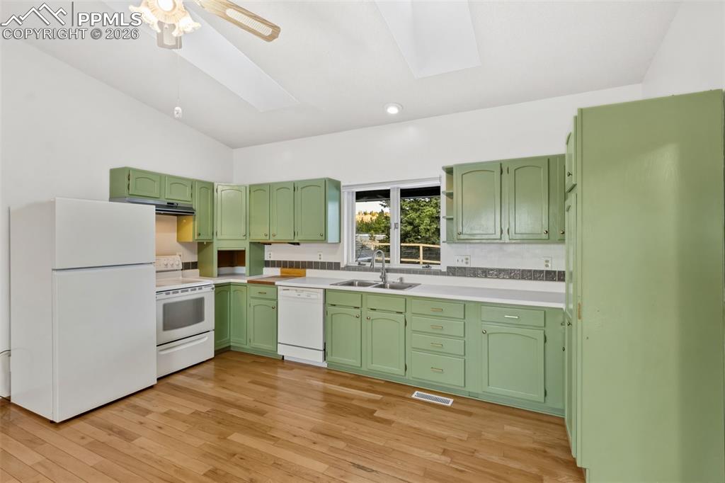 Image 13 of 38: Open Kitchen Concept for older construction is amazing 
