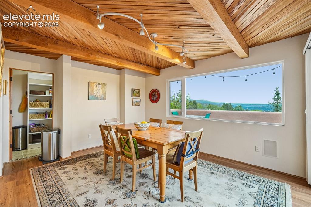Image 12 of 50: Kitchen with quartz countertops, tile backsplash, a large island, ample cab