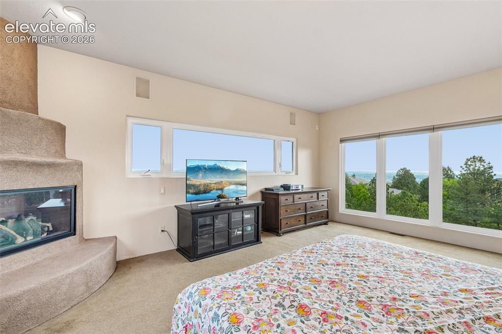 Image 20 of 50: Upper level Primary bedroom with en suite 5 piece bathroom, a walk in close