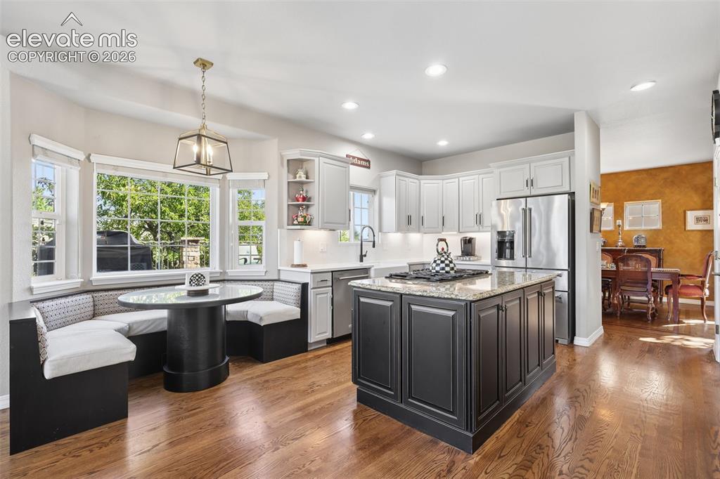 Image 14 of 50: Gorgeous, remodeled kitchen with custom nook seating and table.