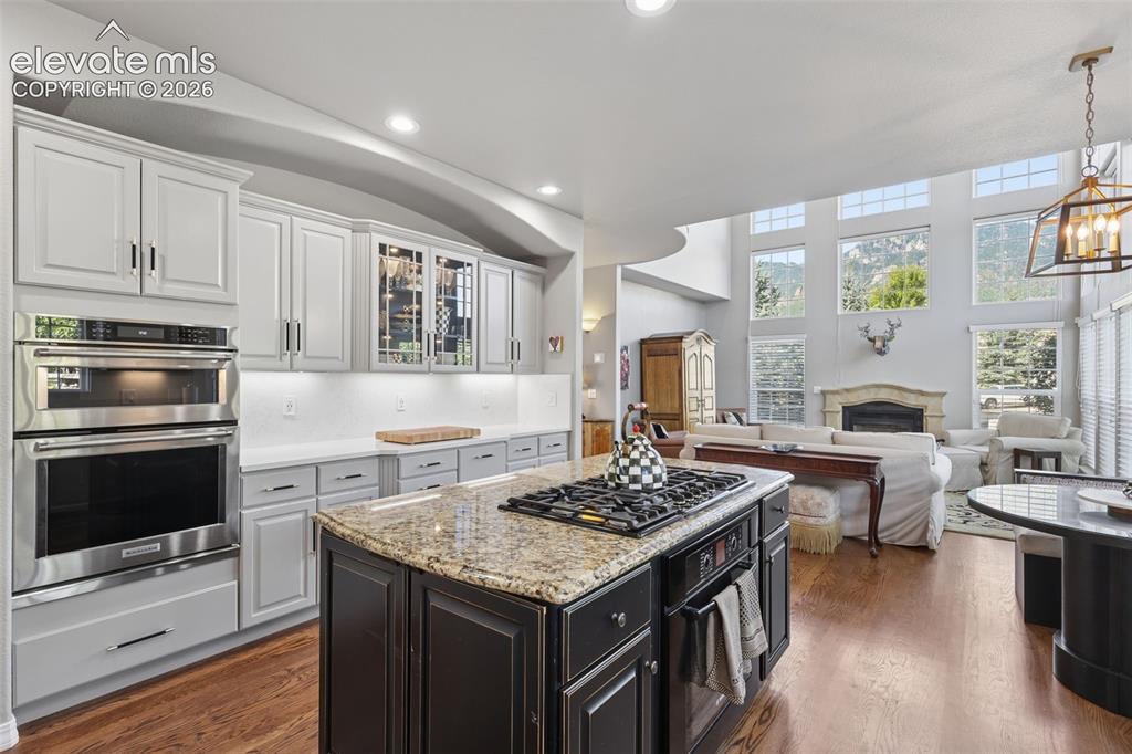Image 17 of 50: Beautifully remodeled gourmet kitchen with granite, quartz, wood floors, is