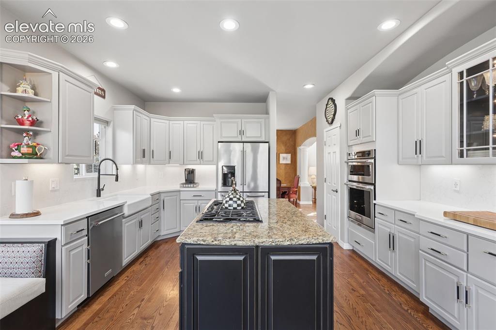 Image 18 of 50: Beautifully remodeled gourmet kitchen with granite, quartz, wood floors, is