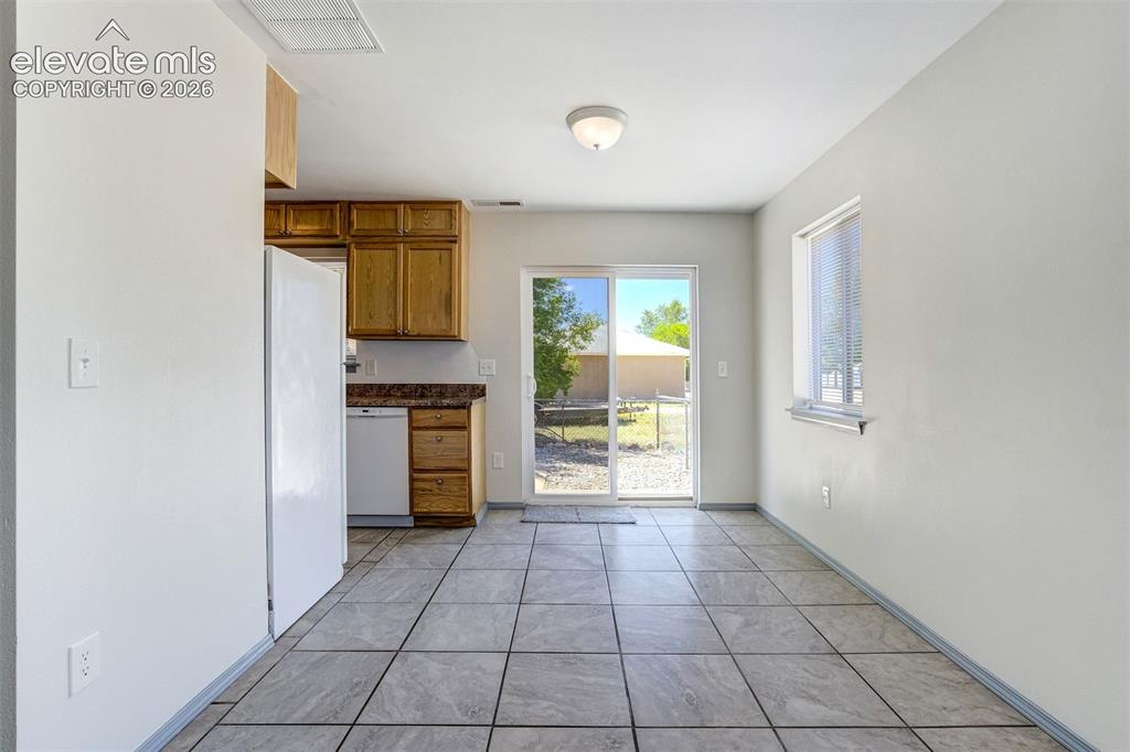 Image 12 of 29: Dining area with views and walk out.