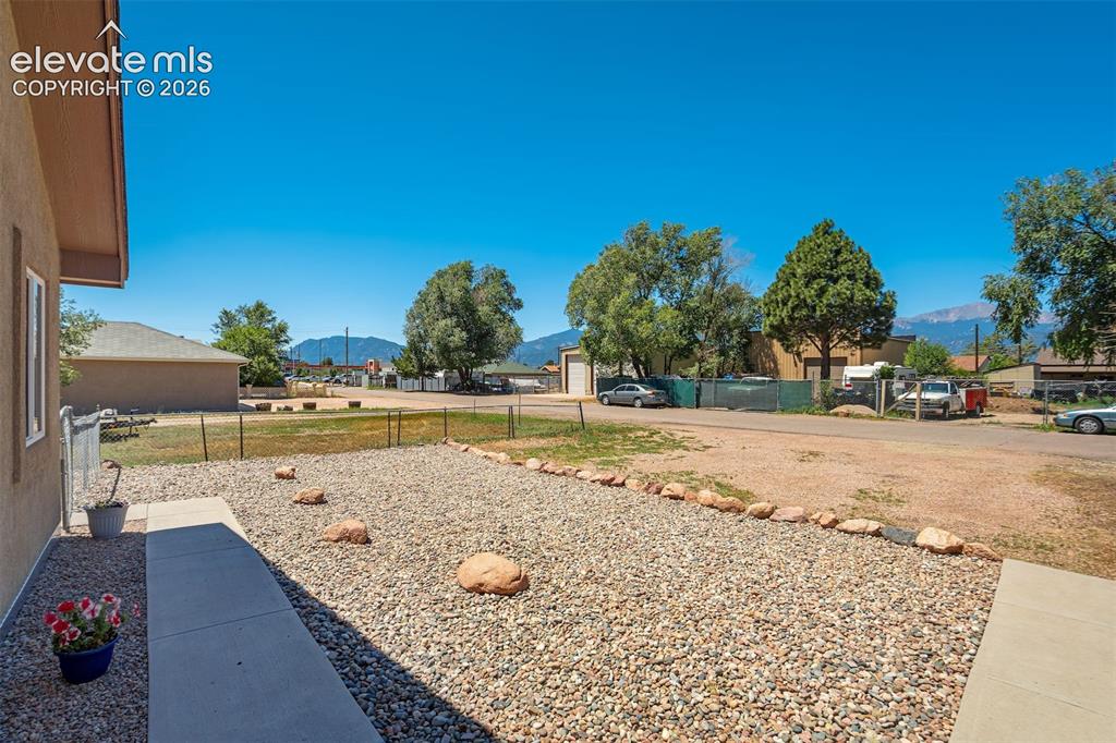 Image 15 of 29: Home sits back off the street with beautiful Front Range views.