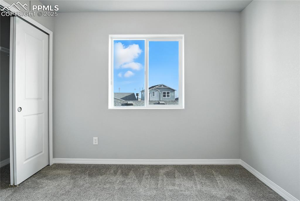 Image 19 of 28: Unfurnished bedroom with carpet floors and a closet