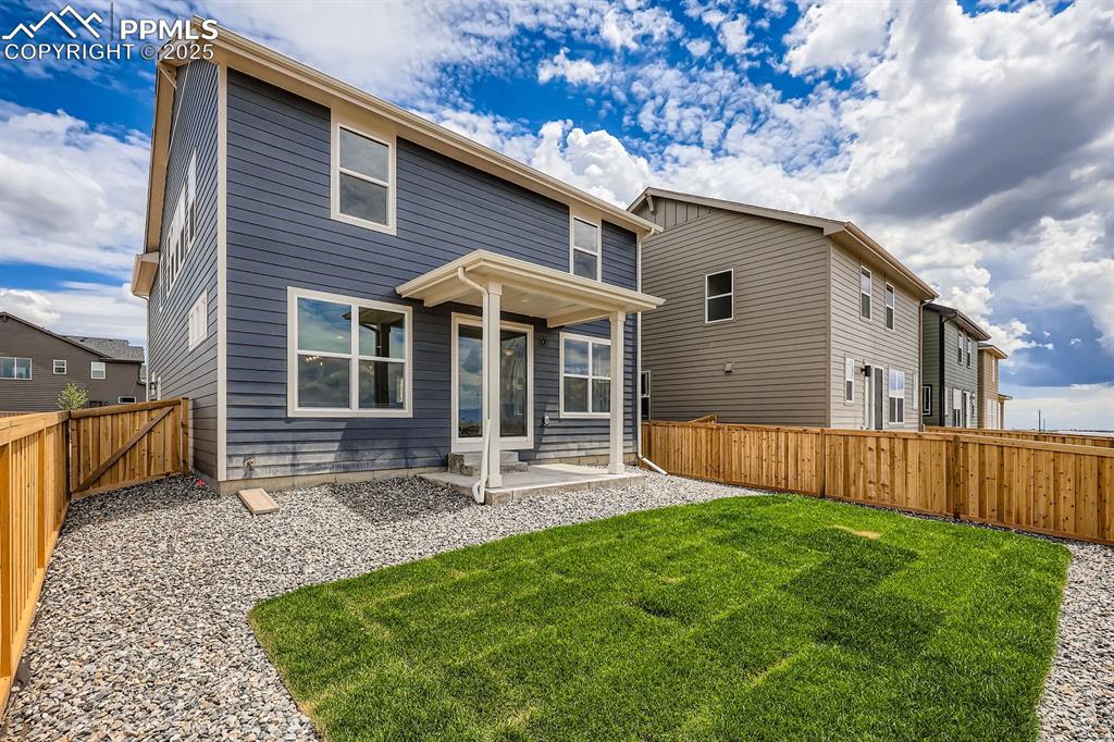 Image 27 of 28: Back of property featuring a fenced backyard and a patio