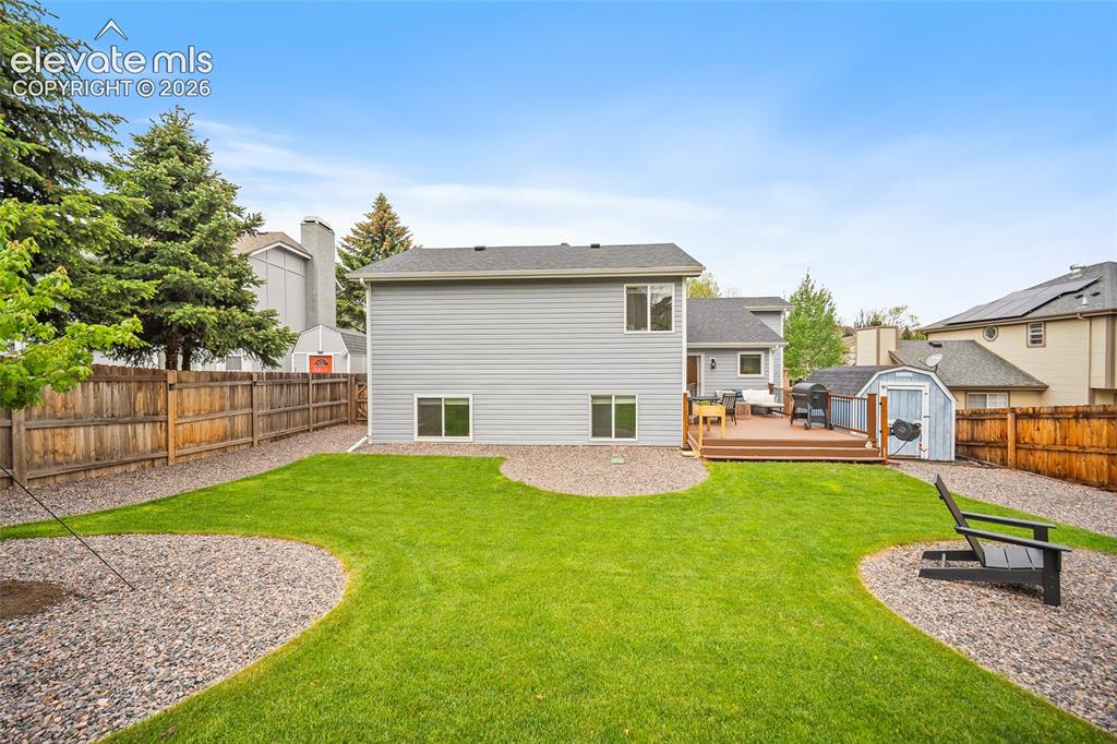 Image 48 of 50: New sod and rock so you can enjoy the backyard this summer