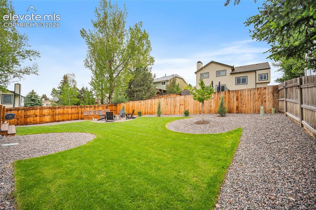 Image 49 of 50: New sod and rock so you can enjoy the backyard this summer