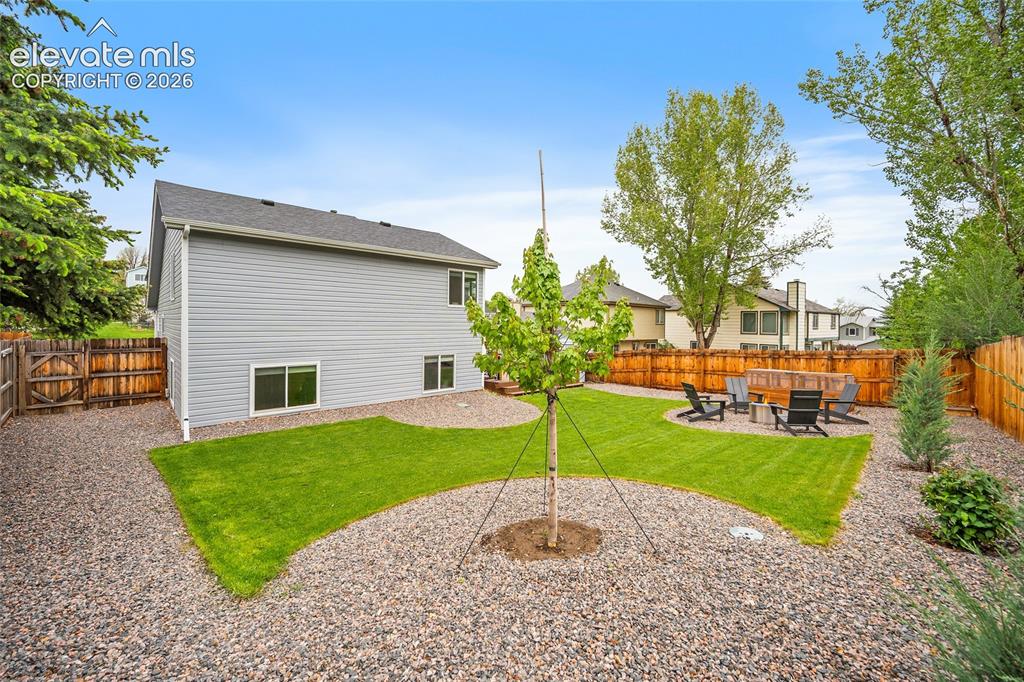 Image 50 of 50: New trees and mature trees, this is a well-cared for property