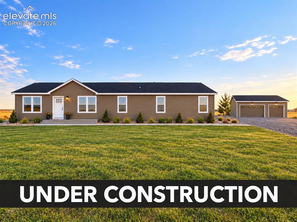 Image 1 of 34: Home & Detached Garage – Wide exterior view showcases rendering of home