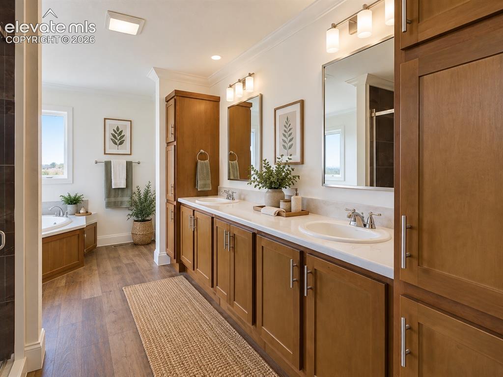 Image 14 of 34: Primary Bathroom – Spacious primary bath features an extended dual-sink van