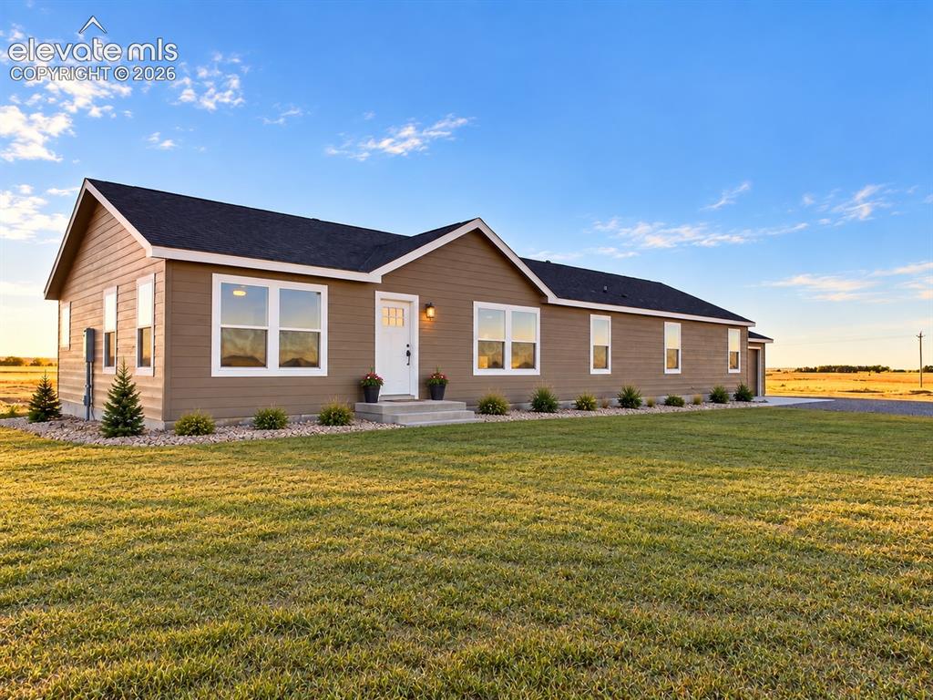 Image 29 of 34: Exterior – Welcoming exterior view showcases rendering of the home’s clean