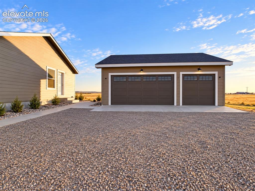 Image 30 of 34: Detached Garage – Detached 3 car garage provides substantial additional par